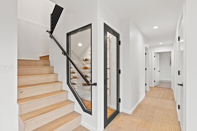 Cedar staircase with under-stair wine cellar